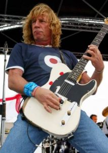 Status Quo performing  songs from their new album 'Heavy Traffic' aboard HMS Ark Royal in Portsmouth Docks.